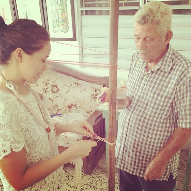 El Sr. Eustaquio Allers teaching me how to work a simple hammock weave. Photo taken at his home in Aguadilla, PR